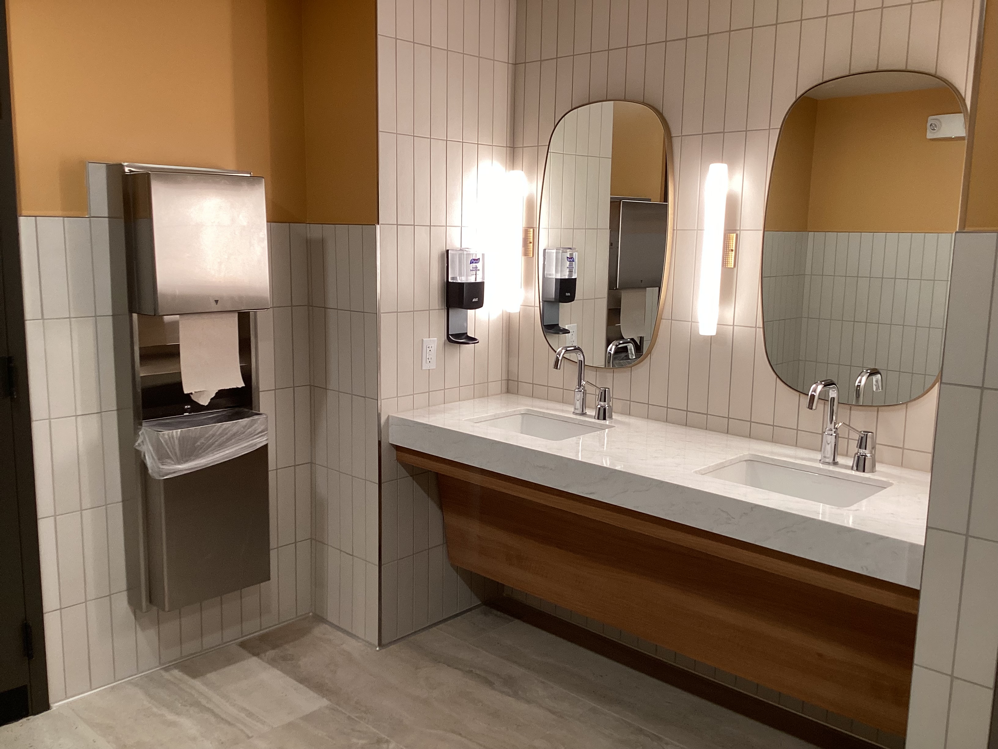 Commercial restroom with custom oval mirrors