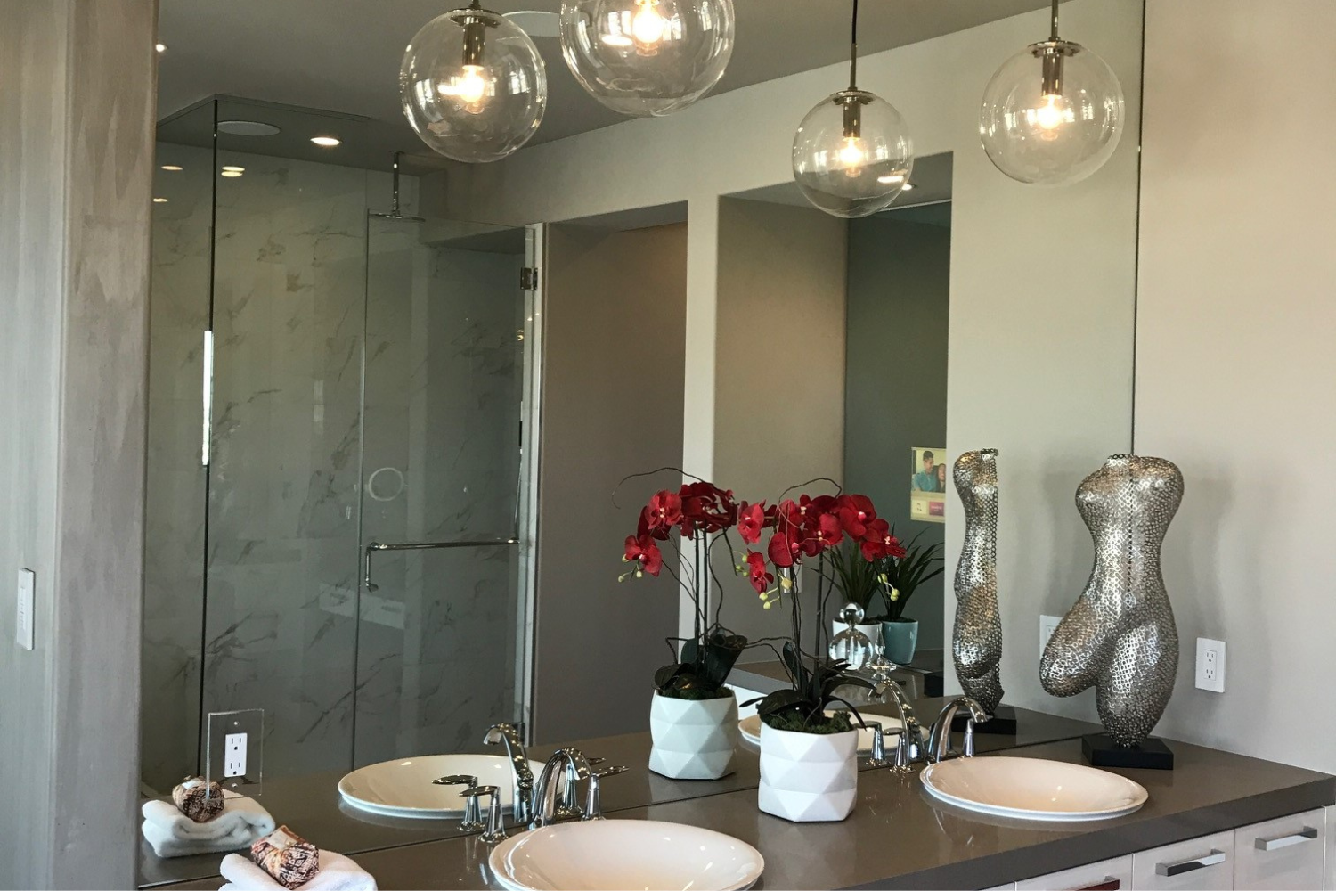 Custom bathroom vanity mirror with pendant lighting