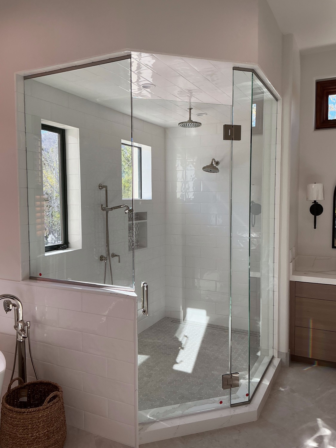 Modern glass panel shower with black hardware