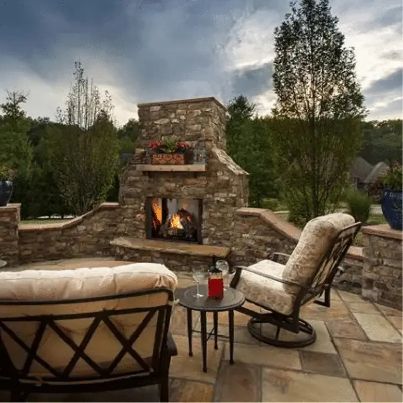 Gas fire pit table on backyard deck